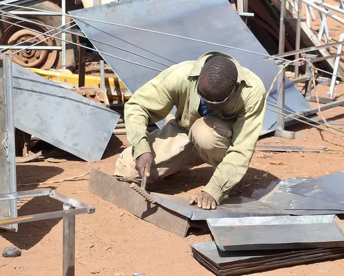 A young artisan at work in a Jua kali setup